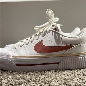 Nike White and Pink Sneakers with Classic Court Design